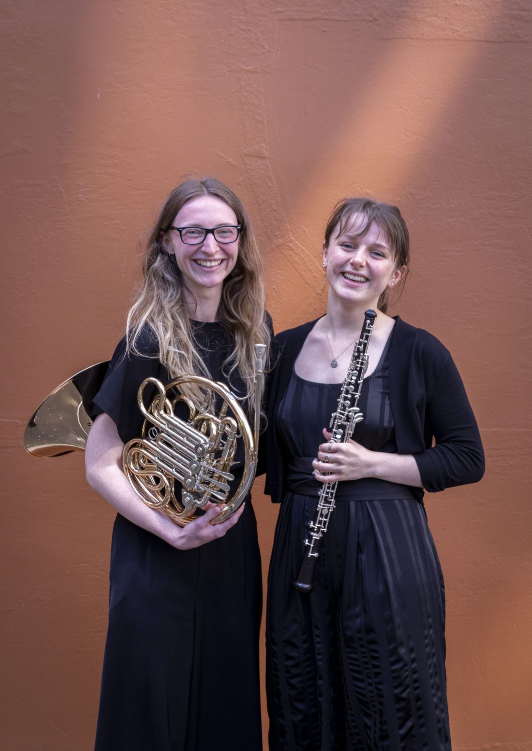 Two young WYOS wind players smiling