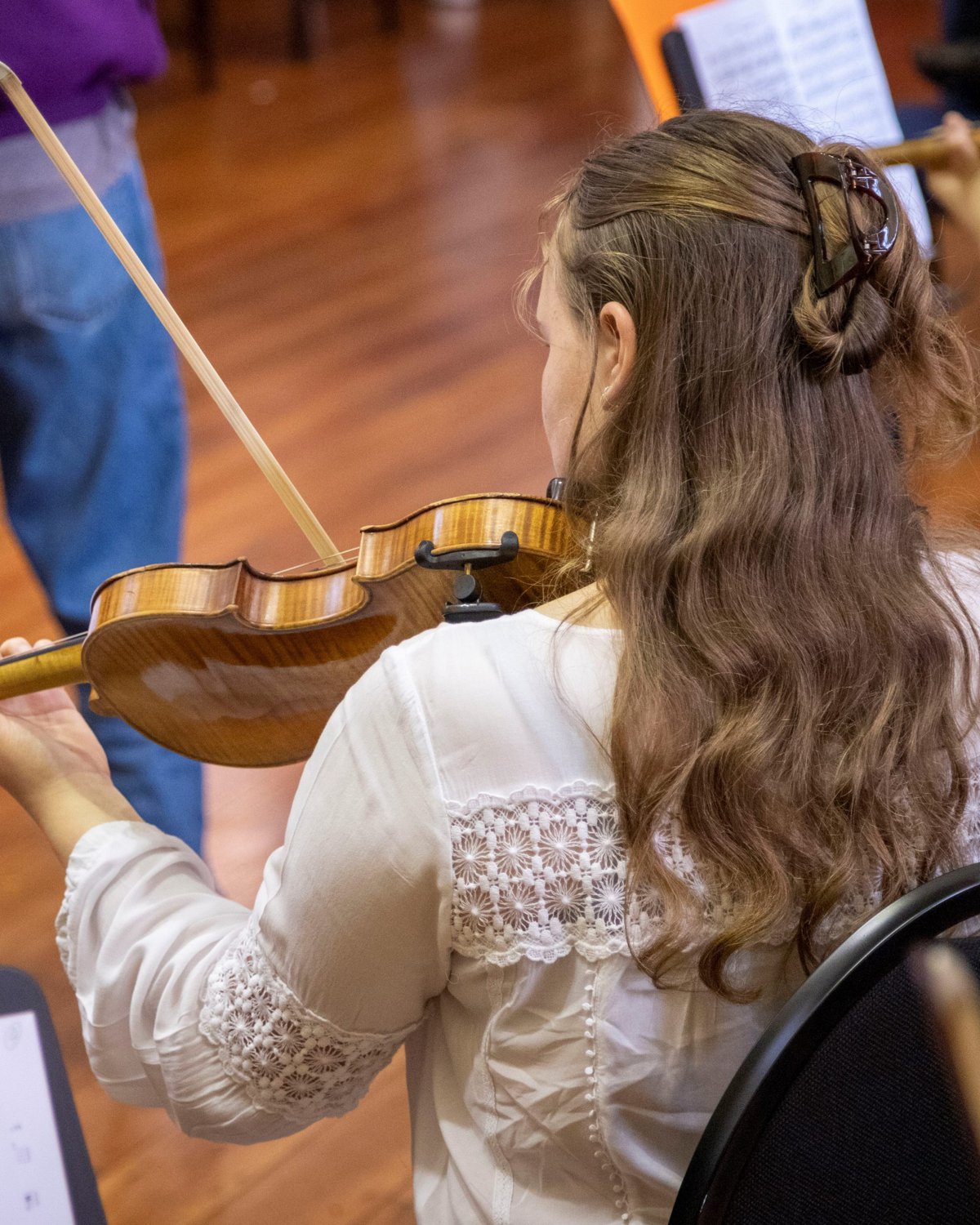 A WYO violinist in rehearsal